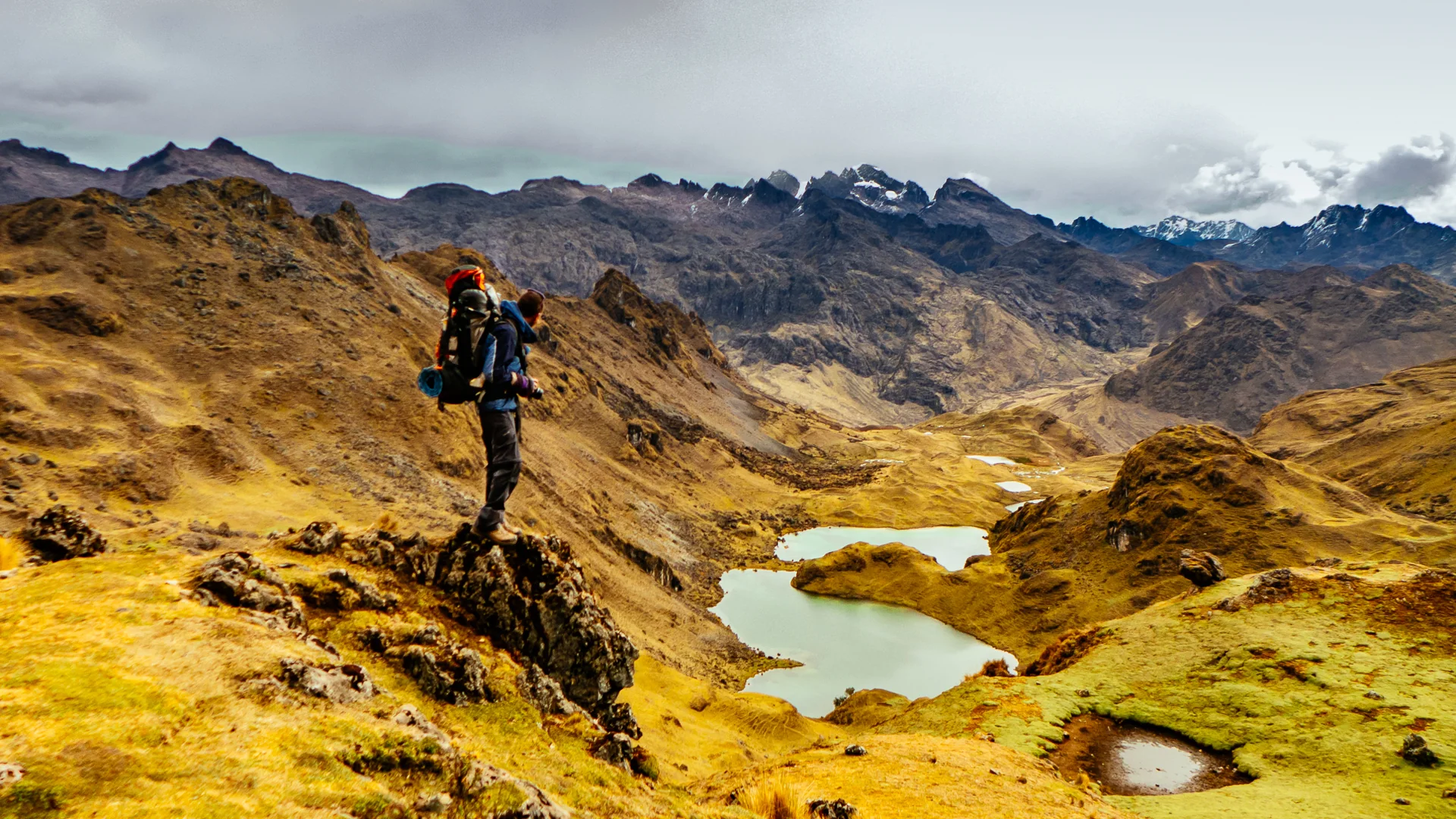 A traveler on a high mountain trail